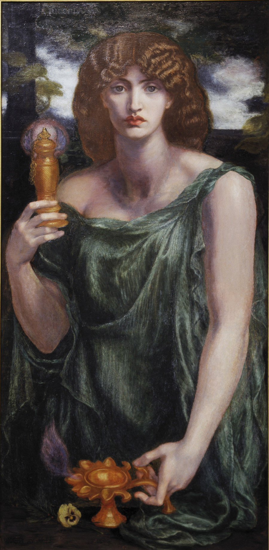 Oil painting of a woman with thick, wavy auburn hair and a serious gaze, in a flowing green robe. She holds up a tall golden vessel in one hand and rests the other on a small golden oil lamp shaped like a flower, with a pale yellow pansy beside it, against dark trees and a cloudy sky.